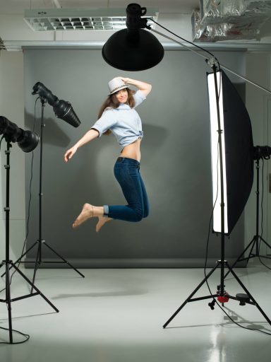 portrait-of-a-jumping-model-working-in-the-professional-photo-studio-SBI-325537178-min